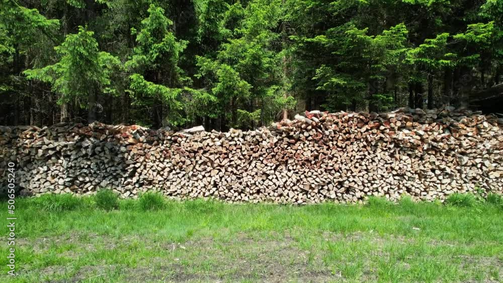 Take-off and flight backward, woodpile, forestry, drone video Take-off and flight backward, woodpile, forestry, drone video