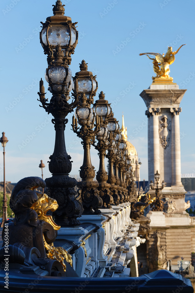 The lampposts of famous Alexandre III bridge , Paris, France