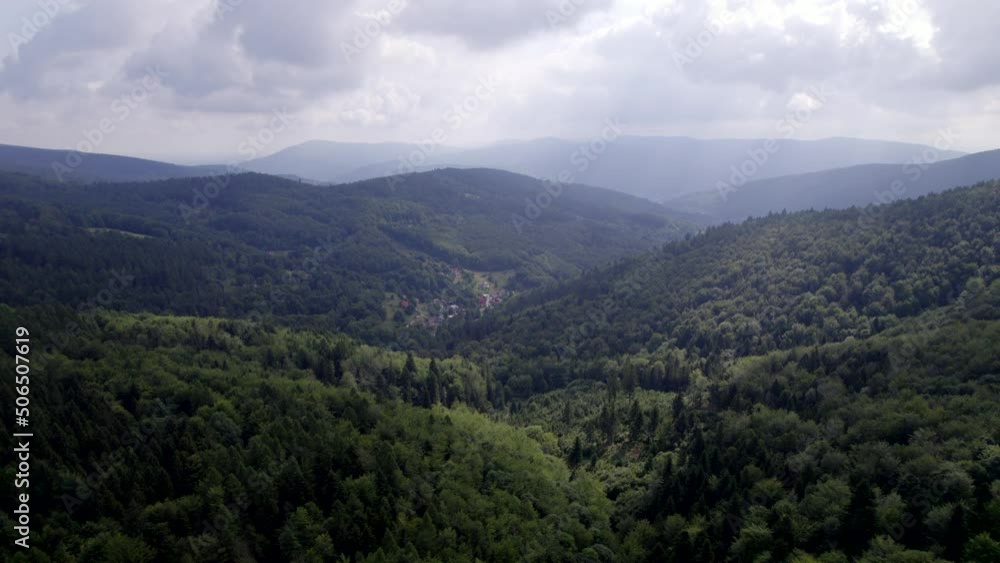 Mountains and forests in the vicinity of Bielsko-Biala. Sunny weather and green trees. The road in the middle of the forest. Mountains and forests in the vicinity of Bielsko-Biala. Sunny weather and green trees. The road in the middle of the forest.