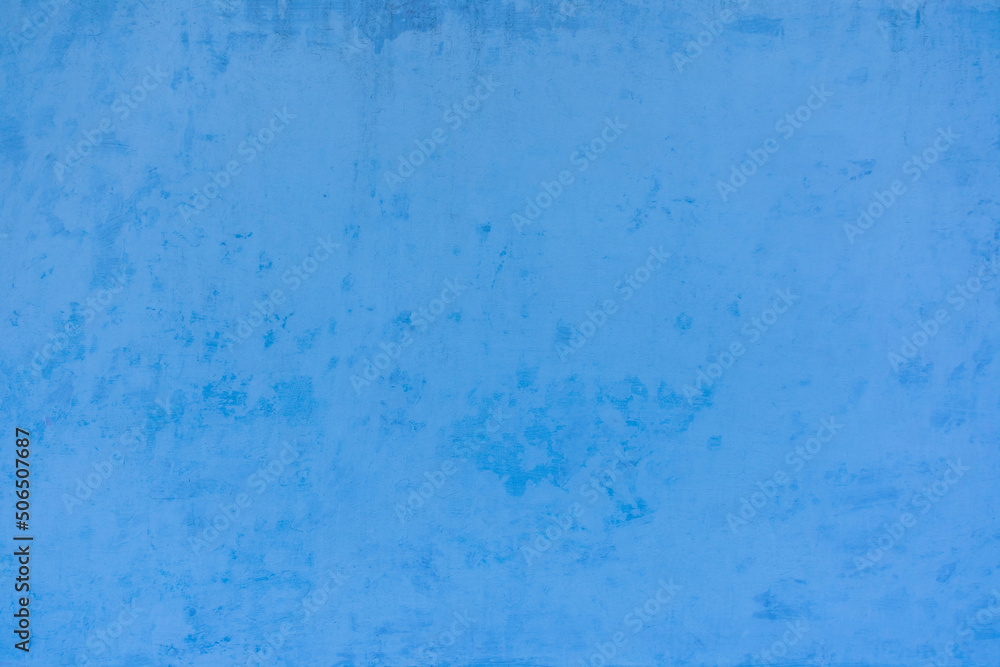 Photo of the light blue colored rough stucco wall texture