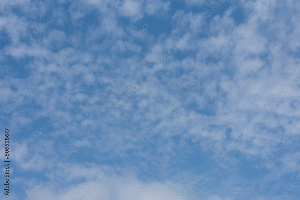 background or texture of light blue sky with summer clouds background or texture of light blue sky with summer clouds