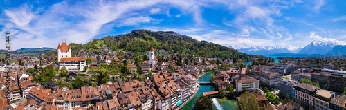Splendid aerial panorama of Thun old town with medieval castle and Alps mountains on background. Incredible beautiful Switzerland. photo