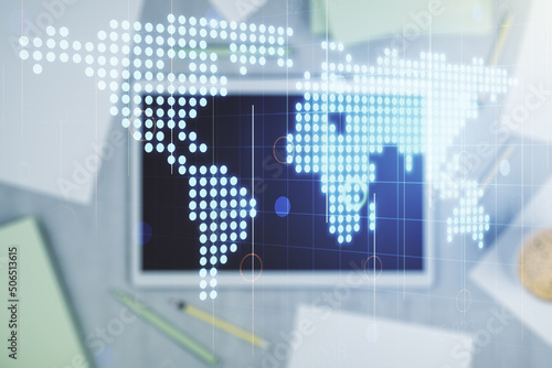 Double exposure of abstract digital world map and digital tablet on background, top view, research and strategy concept