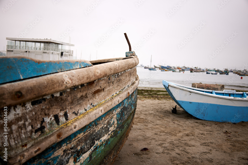 Old wooden fish boat on the beach.  