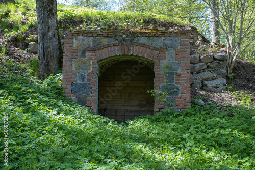 Fototapeta Naklejka Na Ścianę i Meble -  old castle stone underground cellar. wooden board wall, entrance