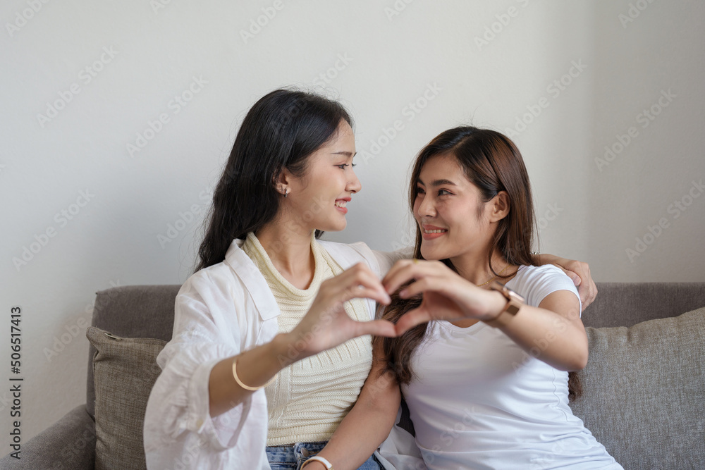 lgbtq, lgbt concept, homosexuality, portrait of two Asian women posing happy together and showing love for each other while being together lgbtq, lgbt concept, homosexuality, portrait of two Asian women posing happy together and showing love for each other while being together