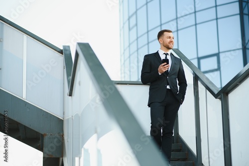 Portrait of an handsome businessman in an urban setting