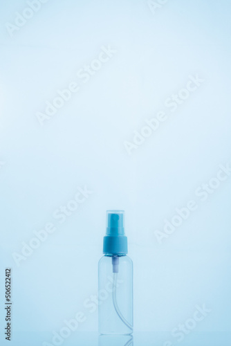 Means for face and body care. A complex of organic care products. Bottles for the transportation of cosmetics traveling by plane. Blue color scheme.