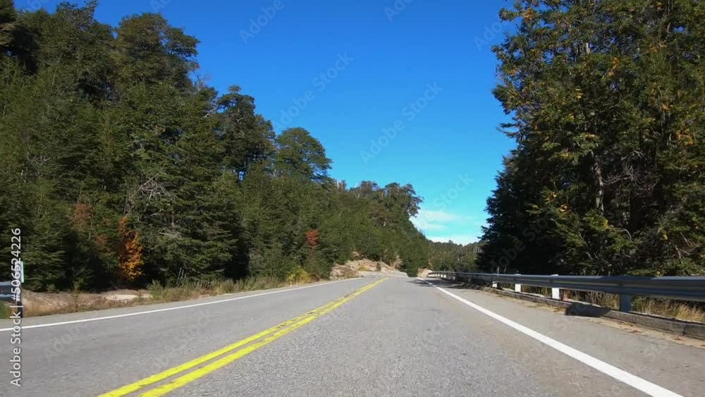 Traveling. Point of view of a car driving along the asphalt highway across the forest in autumn. Traveling. Point of view of a car driving along the asphalt highway across the forest in autumn.