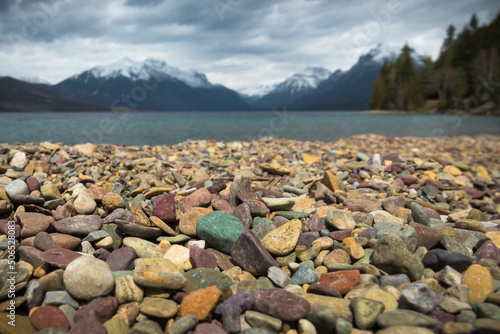 Colorful rocks along the shore of lake McDonald in Glacier National Park, Montana photo