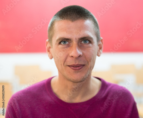 Close up of smiling european man looking at camera