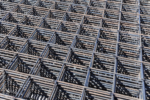 welded mesh for the frame of a monolithic structure lies under the open sky photo