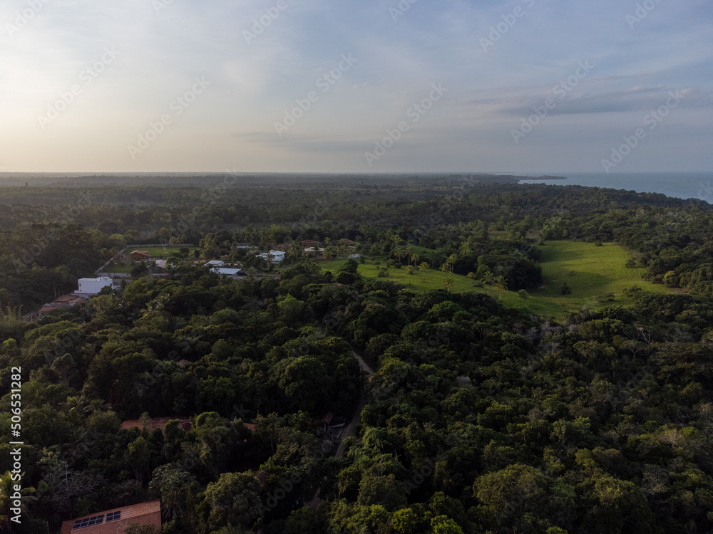 Charming seaside town with the look of a fishing village in the middle of the Atlantic Forest - Cumuruxatiba, Bahia, Brazil - aerial drone view of the beach Charming seaside town with the look of a fishing village in the middle of the Atlantic Forest - Cumuruxatiba, Bahia, Brazil - aerial drone view of the beach