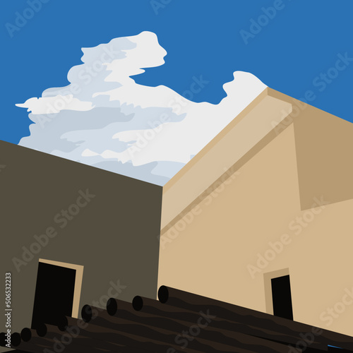 building with blue cloudy sky