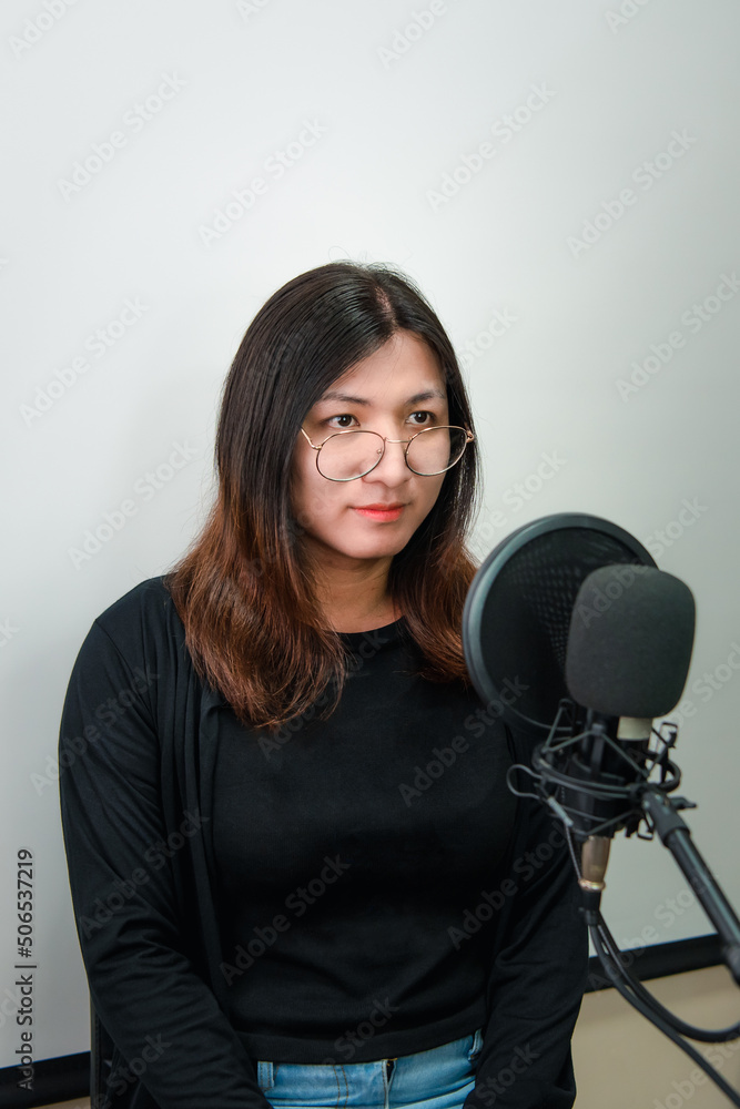 Woman (LGBTQ) singer sing a song with microphone Woman (LGBTQ) singer sing a song with microphone