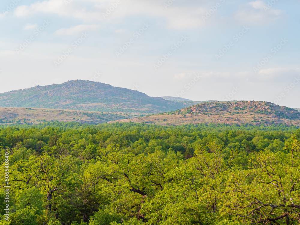 Sunny view of the landscape around Wichita Mountains Wildlife Refuge Sunny view of the landscape around Wichita Mountains Wildlife Refuge