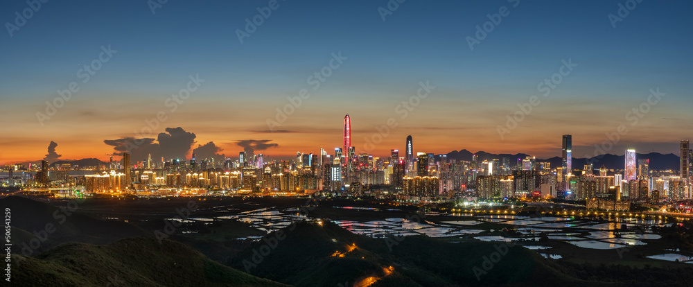 Panorama of skyline of Shenzhen city, China at sunset. Viewed from Hong Kong border