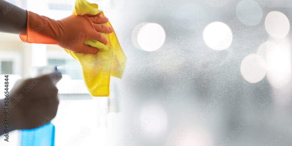 The cleaning service surface sanitizing against COVID19 outbreak Close up view of man clean