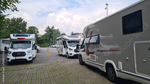 Various RV campervan parked in a parking lot