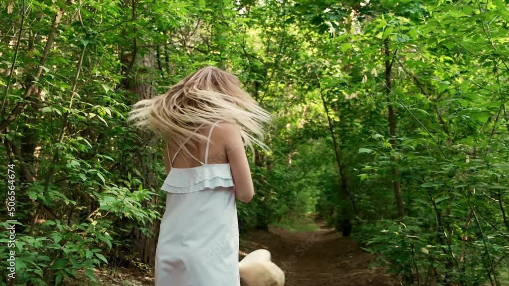 The girl walks through the natural forest. A woman enjoys the sunset. A woman in nature. The imagination of people in the park in the fall. Active lifestyle. People in the woods. Tourist walk through The girl walks through the natural forest. A woman enjoys the sunset. A woman in nature. The imagination of people in the park in the fall. Active lifestyle. People in the woods. Tourist walk through