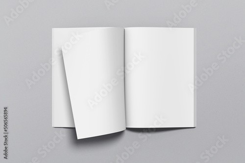 A4 magazine mockup top view, book or catalog on gray table. Blank page or notepad on solid background. Blank page or notepad for mockups or simulations. photo