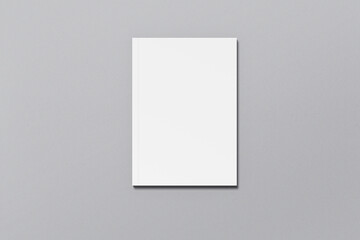 A4 magazine mockup top view, book or catalog on gray table. Blank page or notepad on solid background. Blank page or notepad for mockups or simulations.