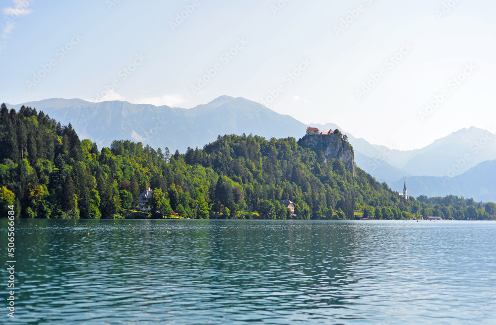 Beautiful view of the Bled landscape. Lake, turquoise water. Mountains and sky.