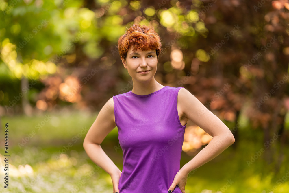 Relaxed non-binary gender person looking at the camera outdoors Relaxed non-binary gender person looking at the camera outdoors