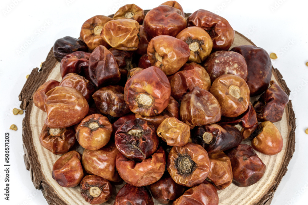 Round Chilli dried, unda mulak, isolated in white background, warm lighting inside the studio, macro details
Round Chilli dried, unda mulak, isolated in white background, warm lighting inside the studio, macro details