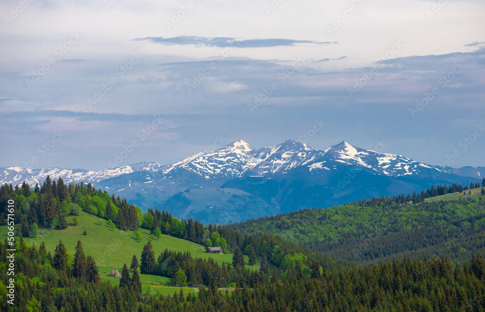 Landscape from the Tihuta pass - Romania with the top of the snow-capped mountains Landscape from the Tihuta pass - Romania with the top of the snow-capped mountains