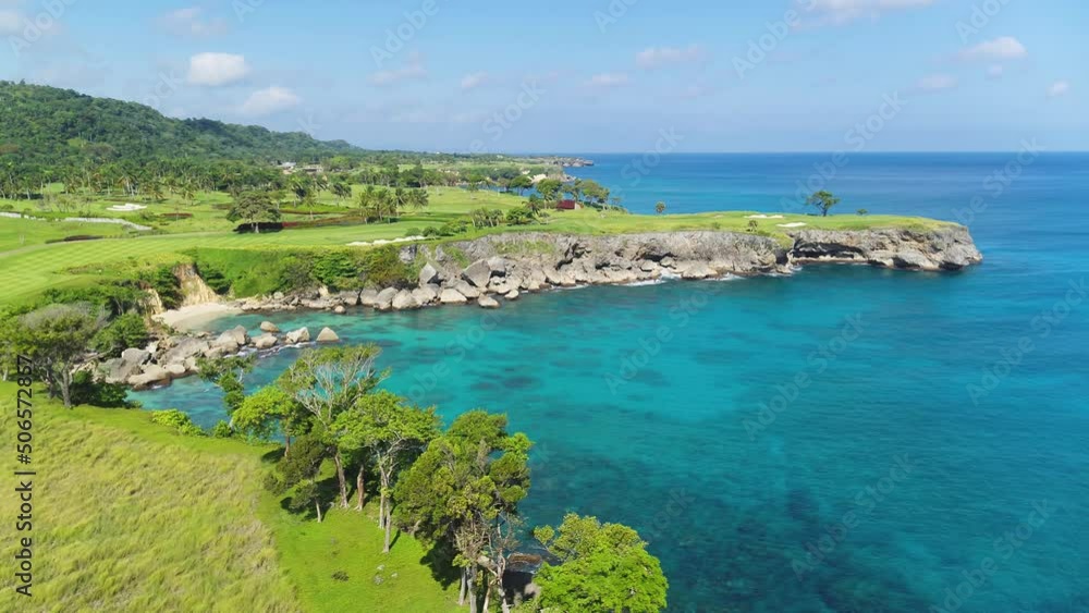 Beautiful seascape. Green peninsula in the blue ocean. Rocky sea coast. Tropical summer park. Golf courses on the sea peninsula. Journey to a tropical paradise. Active rest on the sea. Beautiful seascape. Green peninsula in the blue ocean. Rocky sea coast. Tropical summer park. Golf courses on the sea peninsula. Journey to a tropical paradise. Active rest on the sea.