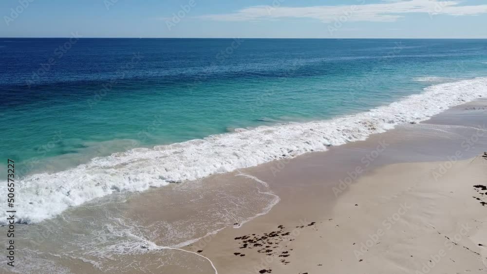 Aerial Turn Right Shot Over Beautiful Long Beach With Turquoise Waters
