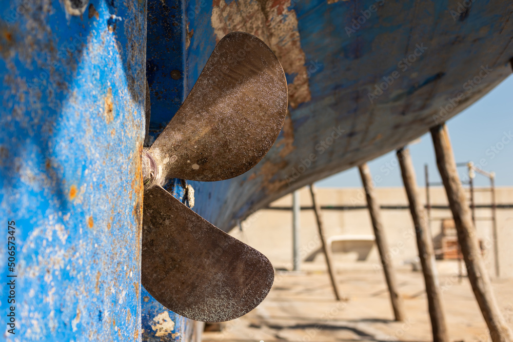 The bottom and propeller of the boat that has been landed for ...