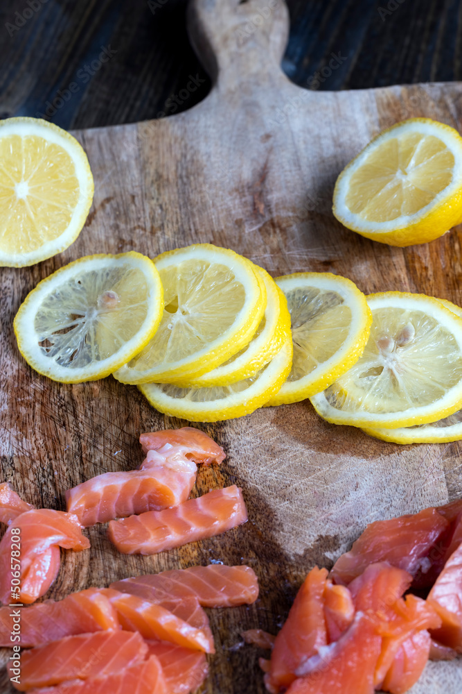 cutting fish fillets during the preparation of a dish of red salmon fish cutting fish fillets during the preparation of a dish of red salmon fish