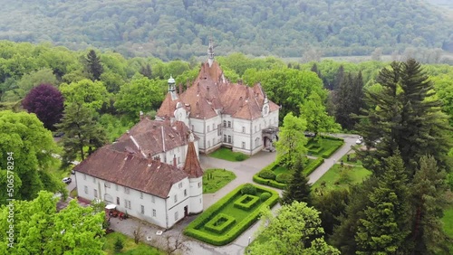 Aerial View Of An Old Palace In The Carpathians (Ukraine) Surrounded By Green Forest photo