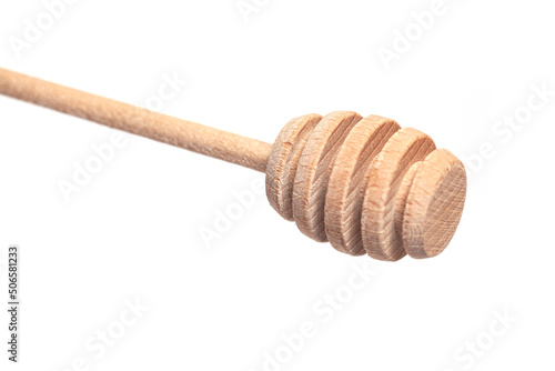 Wooden honey dipper isolated on a white background.