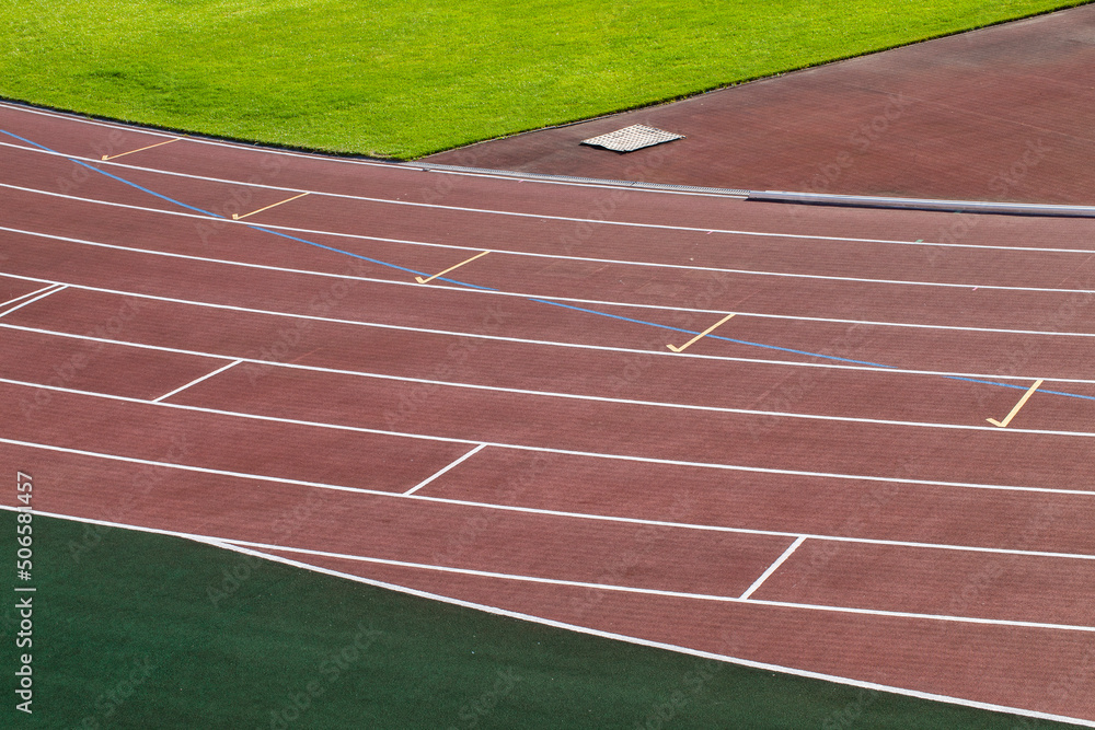 Obraz premium the red surface of the old running track at the stadium