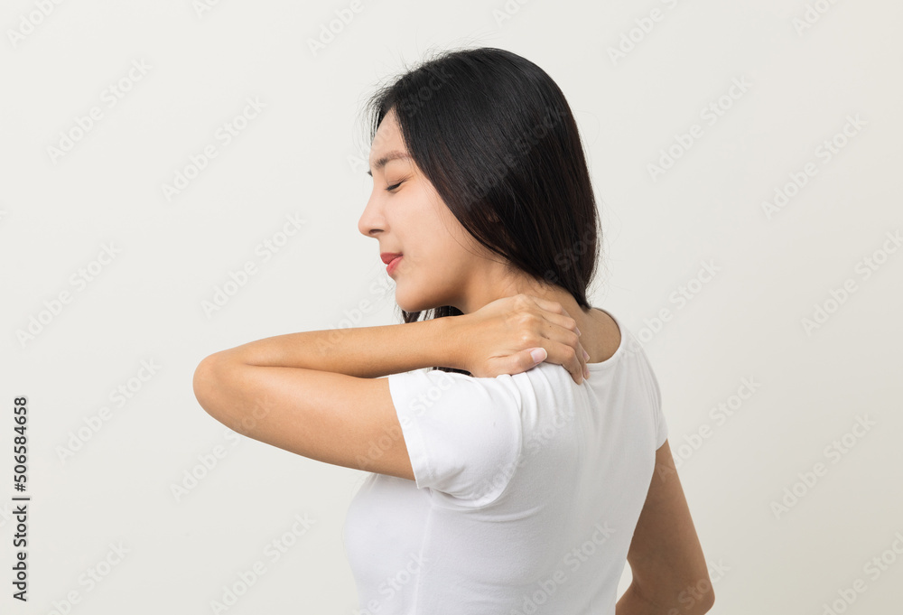 Asian woman has problem with structural posture She had neck and shoulder pain. She massaged her neck and shoulders for relief. reduce muscle tension. Standing on isolated white background Asian woman has problem with structural posture She had neck and shoulder pain. She massaged her neck and shoulders for relief. reduce muscle tension. Standing on isolated white background