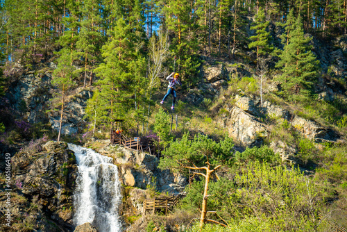 Kamysh waterfall in the Altai Republic, viewing platforms and a platform for descent on a cable rope.