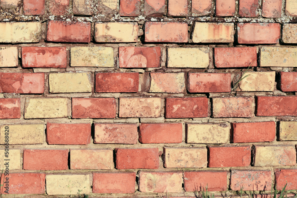 Fototapeta premium Brick wall of yellow and red bricks