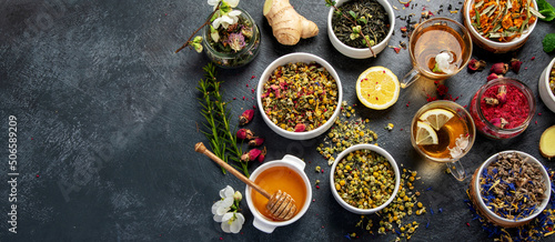 Herbal tea assortment on dark background.