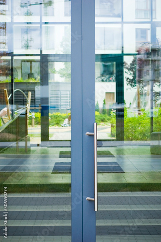 Glass entrance door at modern residental building.