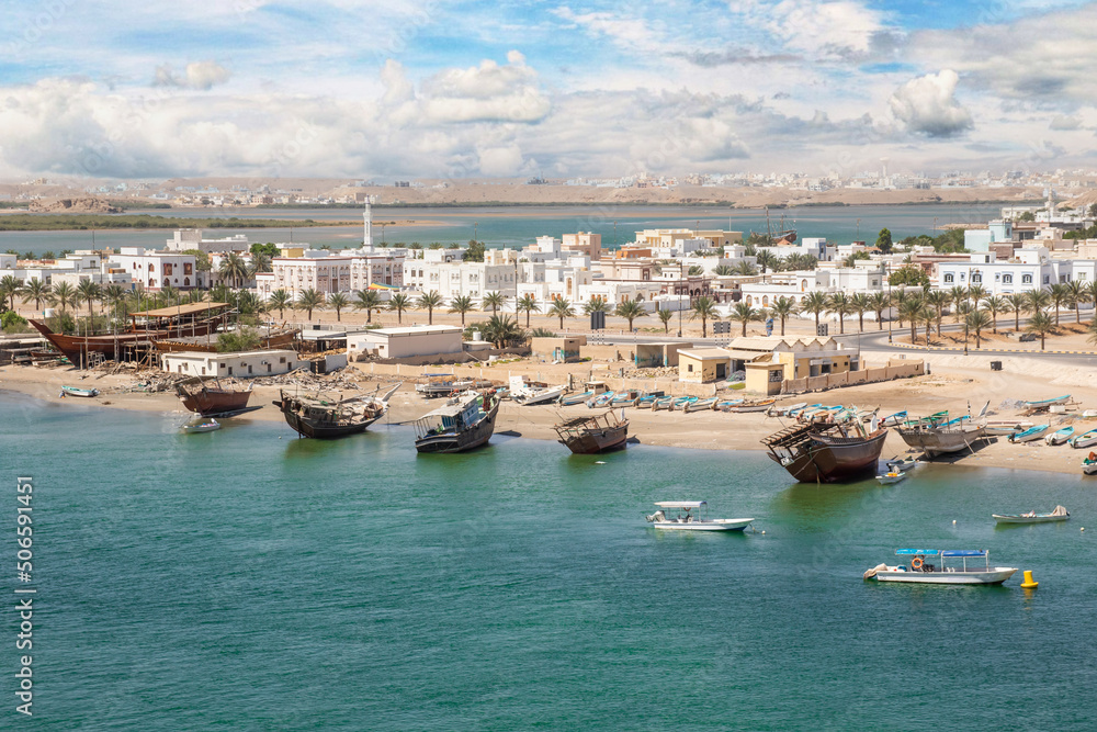Sur, Oman - an important point for sailors and famous also for its building wooden ships, Sur is a pearl of Oman, with its fusion of green waters, white buildings and red rocks