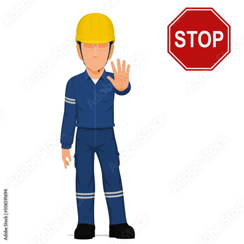 An industrial worker is raise hand to stop