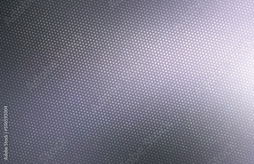 Grid steel dark grey smooth background with diffused light side. Abstract material texture.
