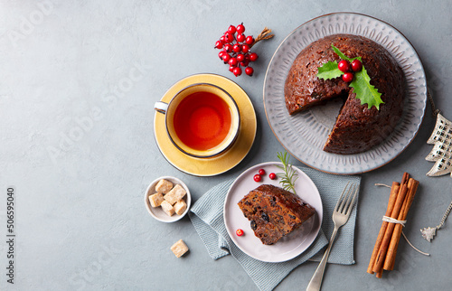 Принти на полотні Christmas pudding, fruit cake with cup of tea