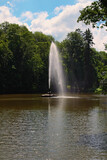 Amazing landscape view of pond with Snake Fountain at sunny day. Arboretum Sofiyivsky Park in Uman, Ukraine. Concept of landscape and nature