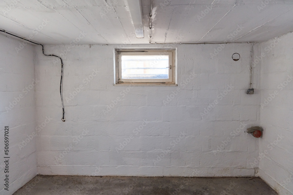 Small cellar room with a cellar window in the cellar of the house Stock