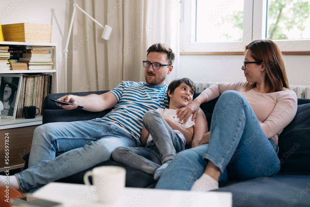 family enjoying time watching movie at home family enjoying time watching movie at home