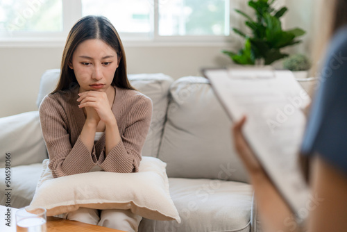 Stressed Asian teens are treated by a psychologist or psychiatrist in a psychiatric clinic or hospital. Patients reported symptoms of depression, stress, irritability, and life problems.